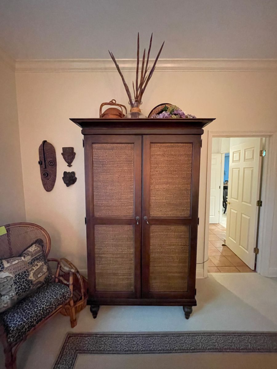 Handsome vintage armoire with woven front, deep crown molding (for Hurwitz-Mintz south Alabama).  W79”, W42”, D24.5”.   Will fit a tv up to 40”.   Has its hanging rod.   $500