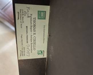 Card attached to bottom of dinning chairs.