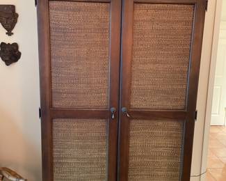 Handsome vintage armoire with woven front, deep crown molding (for Hurwitz-Mintz south Alabama). W79”, W42”, D24.5”. Will fit a tv up to 40”. Has its hanging rod. $500