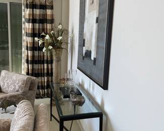 Black metal console with 1/2” beveled edge glass top. 53.5”Lx17.5”Dx28”T. $500