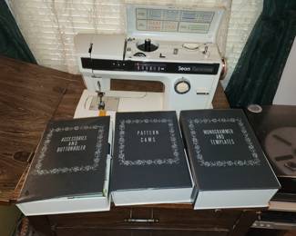 Sears sewing machine with attachements