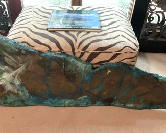 One of two unique metal wall hangings