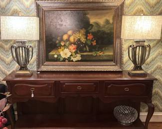 Lovely buffet, art, and matching lamps