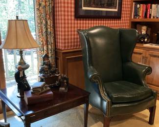 Square table; one of two good-looking green leather chairs with nailhead trim