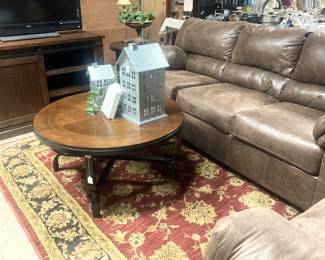 Sofa, round coffee table, and rug