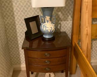 One of two bedside tables and lamps