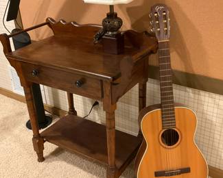 Small side table; Goya guitar