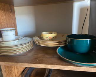 Full set of fine china, as well as three sets of pottery dishes. 