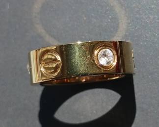 18k Gold and Diamonds Cartier Love Ring $1500. LOVE ring, yellow gold 750, set with 3 brilliant-cut diamonds totaling 0.22 carats. Width: 5.5 mm, Size 5.25-5.5