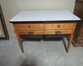 Granite top possum belly table- most likely the bottom of an old hoosier cabinet