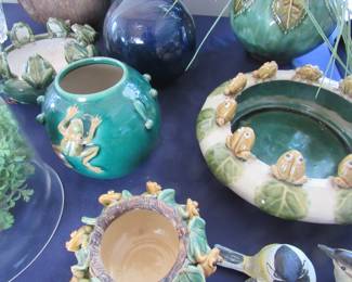 Adorable ceramic pots adorned with frogs