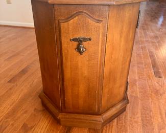 Six-sided end table with door. 