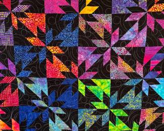Several finished quilts available, as well as partially completed ones.