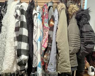 Women’s tops mostly size Large; winter vests, jackets, blouses, shirts, never worn undergarments; pants mostly size Small including multiple pairs of jeans from White House Black Market; shoes in sizes 7 - 8.5, many barely worn. Brands include Suzanne Betro, Lularoe, Ewedoos