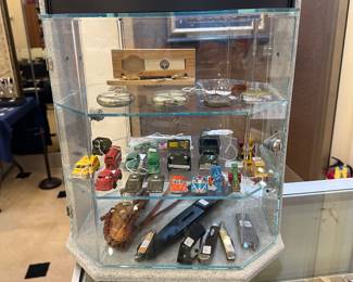 Many collectibles!  Knives, little cars, pocket watches, etc.