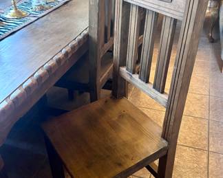Large rustic wood dining table with 8 chairs