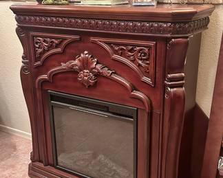 Wood remote controlled fireplace in perfect condition (included with extra wood attachments to make a corner fireplace)