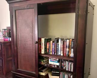 Wood armoire with opening cabinets and shelving 