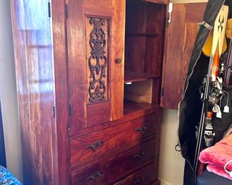 Wood armoire with drawers and metal accent decor
