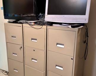 Several File Cabinets - Several Televisions 