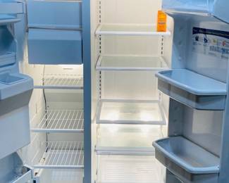 White Whirlpool Side by Side Refrigerator/Freezer.