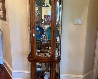 Thomasville lighted curio cabinet with collectibles 