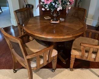 Game table with 4 rolling chairs and decor
