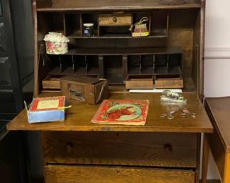 Antique secretary desk, stencil, books and scissors