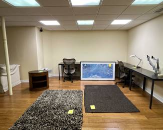 Several desks, rugs, mahogany drum table and rugs from crate and barrel