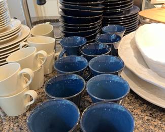 Set of navy blue ceramic dishes.  Service for at least 10.