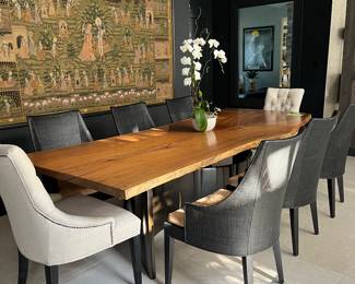 John Hutton for Holly Hunt custom dining table.  The top is a raw edge single slab of walnut and the base is steel.  The pieces is signed by John Hutton on the underside of the wood.