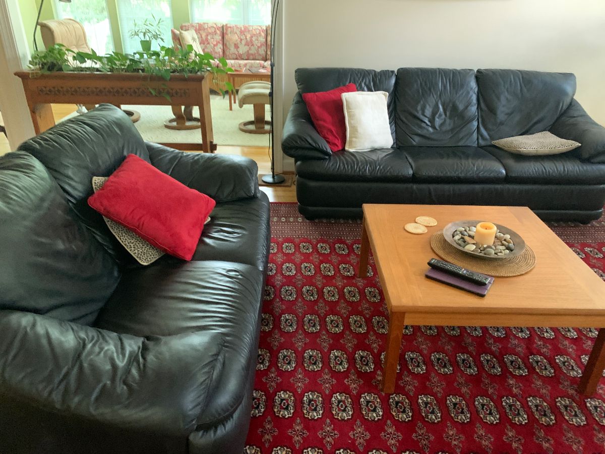 Lovely Natuzi leather sofa with matching love seat.