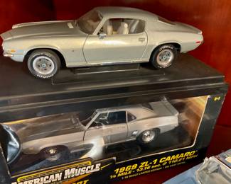 Top car -American muscle Camaro, fast Times at Ridgemont high version, Bottom car - ERTL American muscle, 1967 ZL one Camaro Cortez silver scale, diecast model car
