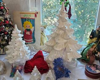 Large TREE HAS THE BLUE lites on  and MIX Colors on small tree