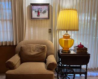 Swivel armchair, large table lamp
(Tea cart was removed by the family)