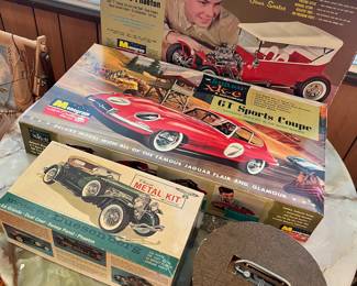 Mid century modern marble and wood table, vintage car models and toys