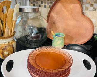 Large vintage copper heart pan / Price: $70 -- Large round general store canister / Pink depression glass plates / Wooden kitchen utensils