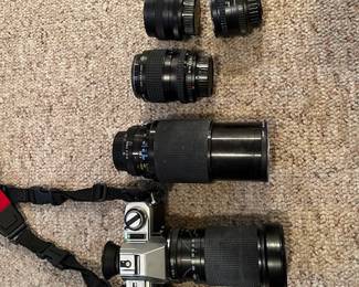 Minolta X-370 with various lens accessories. 