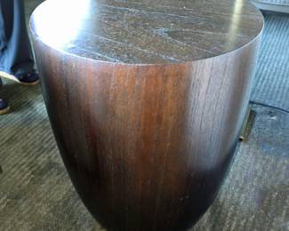 There are two Crate & Barrel conga drum-shape tables.