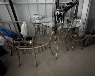 Glass top tables and elephant and planter