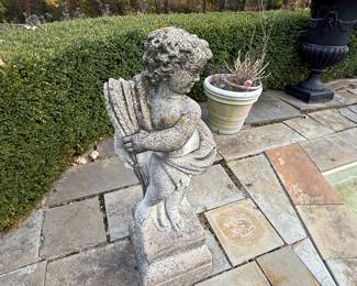 Many Concrete Statuary Pieces around