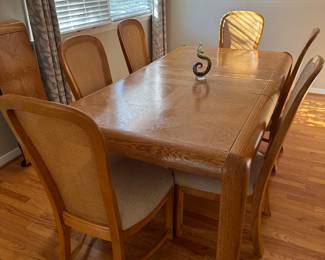 Dining room table with 2 leaves and 6 chairs. Table well cared for and in great condition.