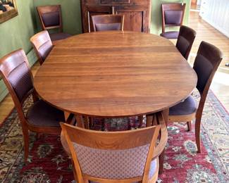 Thomas Moser Dining Table and 8 Chairs (2 with Arms 6 without Arms) Solid Cherry, signed and meticulously cared for over 41 years.
