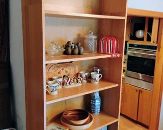 6 Tier Bookcase, Circle of Cats Votive Candle Holder, Crystal Swirl Pattern Cookie Jar, Set of 4 Lenox Winter Greetings Mugs, Folk Art Cat Collapsable Basket, Glass Sleeping Kitten on Nest Candy Dish, Pair of Turned Wood Bowls