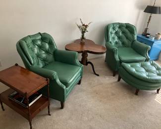 Pair of green club chairs, clover leaf table, antique mahogany table on castors