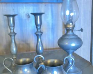 Pewter sugar and creamer, pewter candlesticks, pewter oil lamp