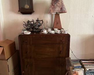 Chest of Drawers w/ Bakelite Handles, Wall Clock, Lamp, Silver Plate Tea Set, Demitasse Cups & Saucers