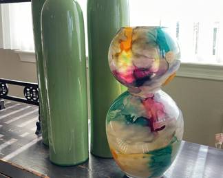 Ceramic and glass vases. Black low profile table. 13”H x 58.5 L x17.5 W