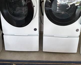 Just purchased earlier this year. Whirlpool washer and electric dryer set with drawer risers. 