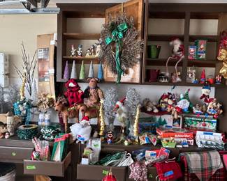 Stocking holders, figures, candles, wreaths, ornament storage, vintage lights, table runners, Christmas gift bags and tissue. 